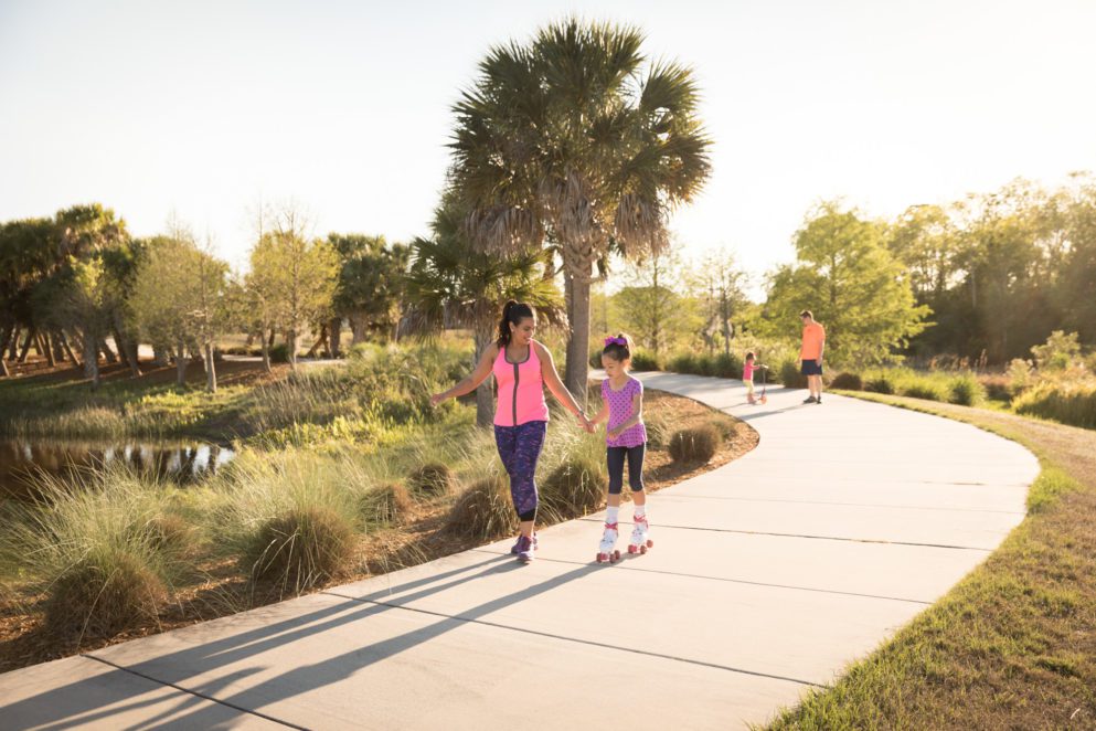 kids family on sidewalk trail in laureate park